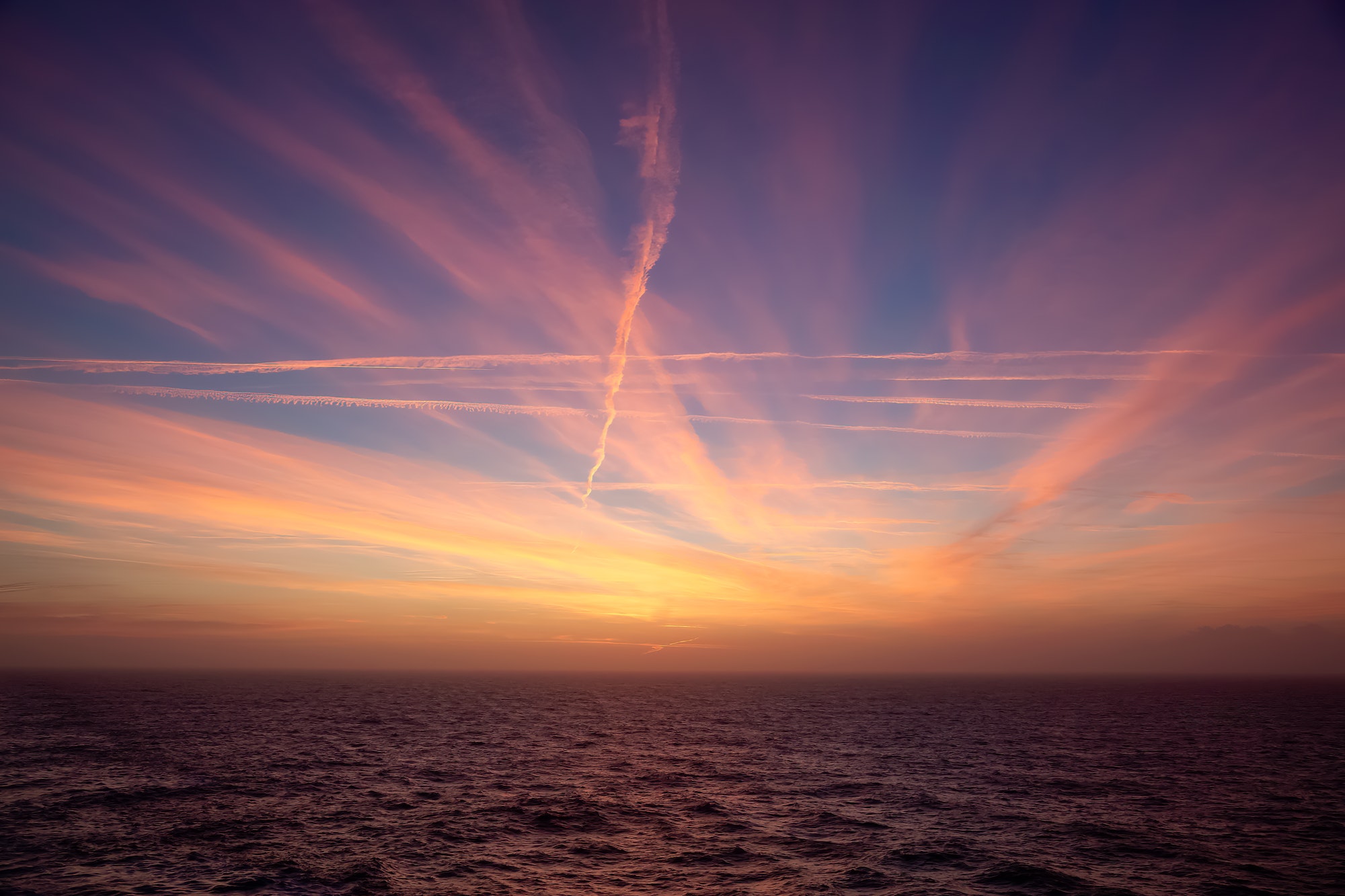 Dramatic Colorful Sunrise Sky over North Atlantic Ocean. Cloudscape Nature Background